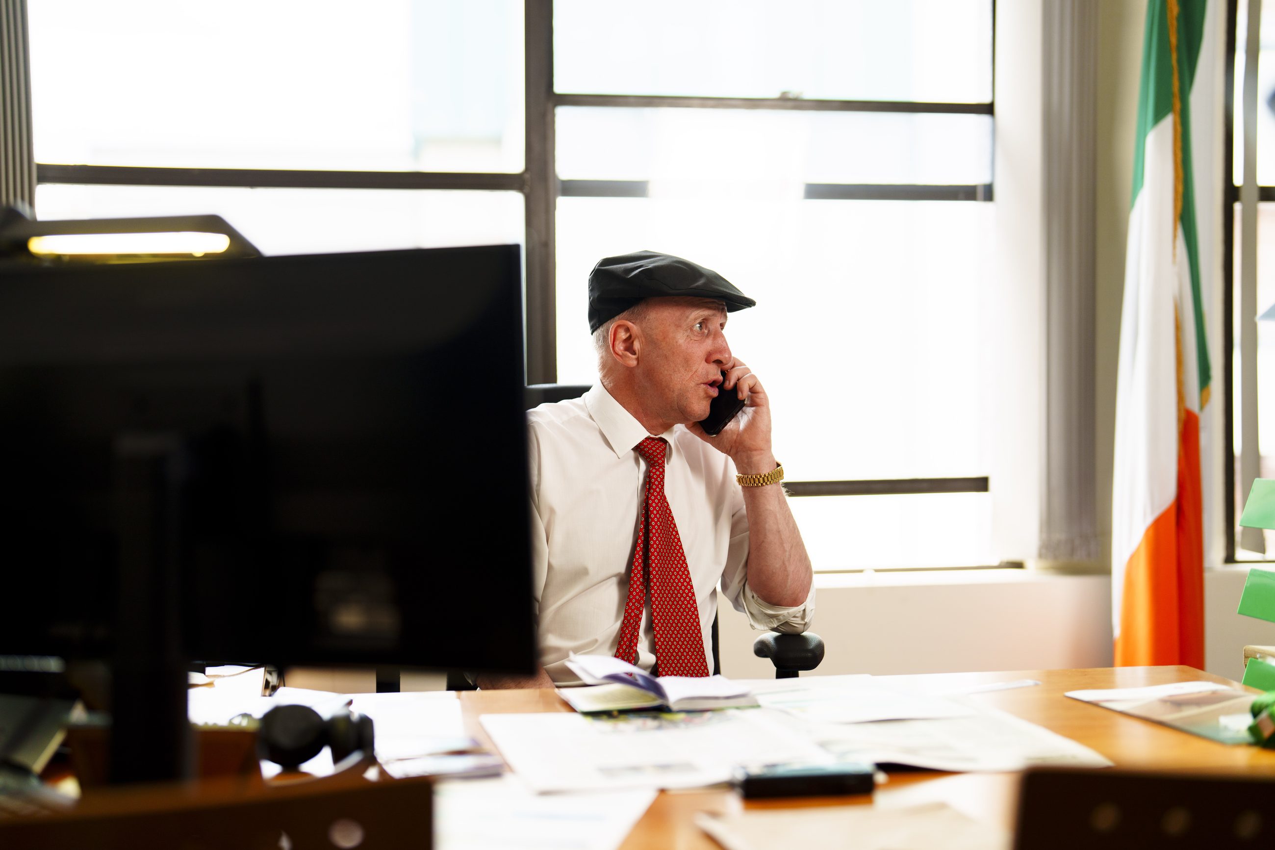Michael Healy-Rae on the phone at his desk in Kerry