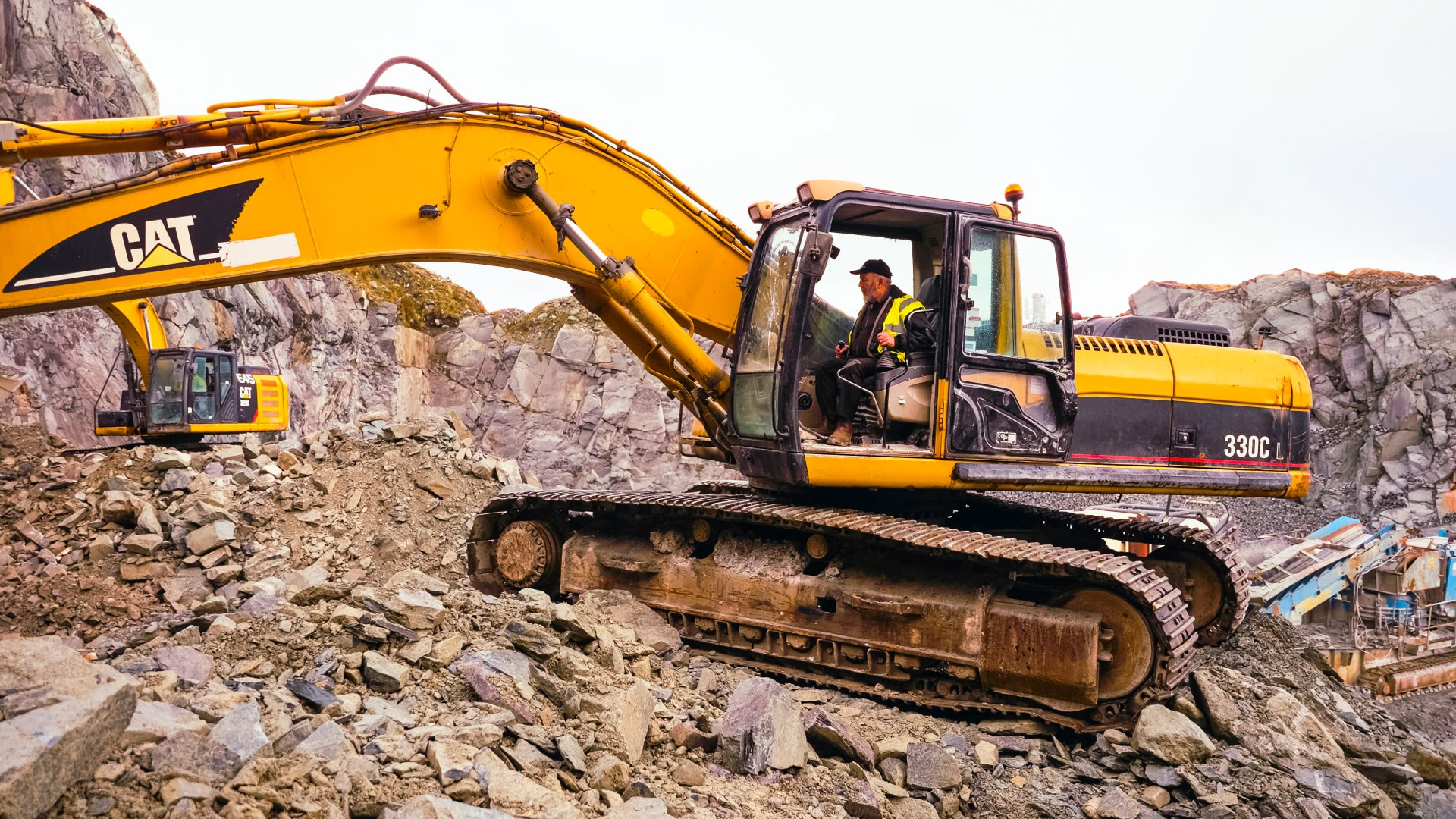 Danny Healy-Rae at the controls of a CAT excavator in the quarry